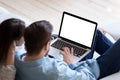 Loving couple looking at laptop screen blank white mockup Royalty Free Stock Photo