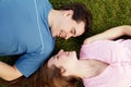 Loving couple lying on a grass Royalty Free Stock Photo