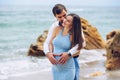 Loving couple making heart shape on the pregnant belly with their hands. Royalty Free Stock Photo