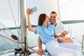 Loving Couple Making Selfie On Phone Kissing Enjoying Yacht Ride