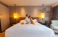 Loving couple of man and woman lying and relaxing together in hotel Royalty Free Stock Photo