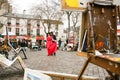 Loving couple on Montmartre among street artists. tourist destination