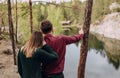 loving couple outside hugging lake canyon sunset