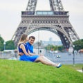 Loving couple in Paris near the Eiffel tower Royalty Free Stock Photo