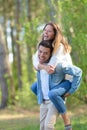 loving couple piggyback in park Royalty Free Stock Photo