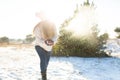 Loving couple play snowballs in winter in the forest. Girl sculpts and throws snowballs. Laugh and have a good time Royalty Free Stock Photo