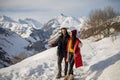 A loving couple plays together in the snow outdoors. Winter holidays in the mountains.