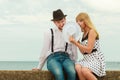 Loving couple retro style dating on sea coast Royalty Free Stock Photo