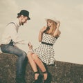 Loving couple retro style dating on sea coast Royalty Free Stock Photo