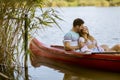 Loving couple rowing on the lake