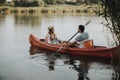 Loving couple rowing on the lake