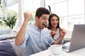 Loving couple sitting in cafe using laptop computer Royalty Free Stock Photo