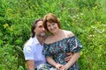 Loving couple sitting on the grass in summer Royalty Free Stock Photo