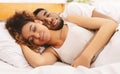Loving couple sleeping in bed and hugging Royalty Free Stock Photo