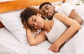 Loving couple sleeping in bed and hugging Royalty Free Stock Photo