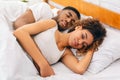 Loving couple sleeping in bed and hugging Royalty Free Stock Photo