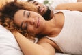 Loving couple sleeping in bed and hugging Royalty Free Stock Photo