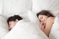 Loving couple sleeping peacefully in comfortable bed, falling as Royalty Free Stock Photo