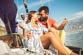 Couple spending happy time on a yacht at sea. Luxury vacation on a seaboat Royalty Free Stock Photo