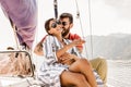 Couple spending happy time on a yacht at sea. Luxury vacation on a seaboat Royalty Free Stock Photo