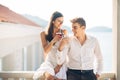 Loving couple spending vacation on tropical resort swimming pool.Newlyweds honeymoon on seaside Royalty Free Stock Photo