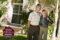 Loving Couple Standing In Front Of House Royalty Free Stock Photo