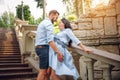 Loving couple are standing on stairs. They are waiting birth of baby. Royalty Free Stock Photo