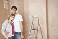 Loving Couple Standing In Unrenovated Room Royalty Free Stock Photo