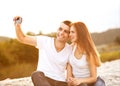 Loving couple taking selfie in the park Royalty Free Stock Photo