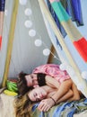 Loving couple in tent. Pair in love camping. Portrait of happy man woman.
