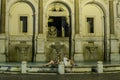 Loving couple of tourists on the background of the night fountain Aqua Paola in Rome Royalty Free Stock Photo