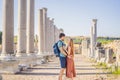 Loving couple of tourists at the ruins of ancient city of Perge near Antalya Turkey. Traveling with kids concept Royalty Free Stock Photo