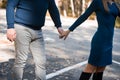 Loving couple on a walk in the autumn park holding hands. Love Royalty Free Stock Photo