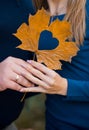 Loving couple on a walk in the autumn park holding hands Royalty Free Stock Photo