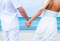 Loving couple walking and embracing on the beach Royalty Free Stock Photo