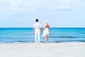 Loving couple walking and embracing on a summer beach Royalty Free Stock Photo