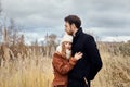 Loving couple walking in Park in autumn hugs and kisses. Autumn Royalty Free Stock Photo