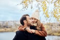 Loving couple walking in Park in autumn hugs and kisses. Autumn Royalty Free Stock Photo