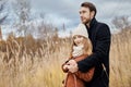 Loving couple walking in Park in autumn hugs and kisses. Autumn Royalty Free Stock Photo