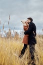 Loving couple walking in Park in autumn hugs and kisses. Autumn Royalty Free Stock Photo