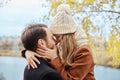 Loving couple walking in Park in autumn hugs and kisses. Autumn Royalty Free Stock Photo