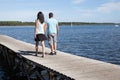 Loving couple walking on pontoon in summer Royalty Free Stock Photo