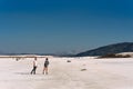 A loving couple walks along the coast of lake Salda in Turkey. Couple travels in Turkey. Lake Salda in Turkey. A lonely pair.