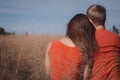 The loving couple walks on the wheat field Royalty Free Stock Photo