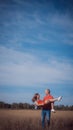 The loving couple walks on the wheat field Royalty Free Stock Photo