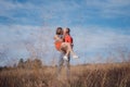 The loving couple walks on the wheat field Royalty Free Stock Photo