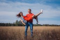 The loving couple walks on the wheat field Royalty Free Stock Photo