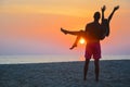 Couple watching the sunset on the beach