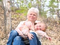 Loving cute granddaughter hugging her grandmother. Happy family.  Having good times with grandparent outdoors Royalty Free Stock Photo