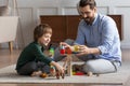 Loving dad have fun playing with little son at home Royalty Free Stock Photo